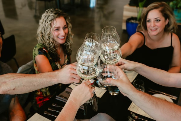 smile, automotive design, dress, stemware, social group, chair